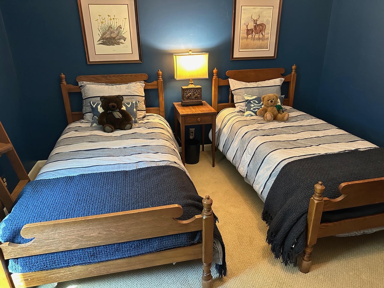 Brentwood Cove — Before, twin bedroom with teal walls and wood furniture