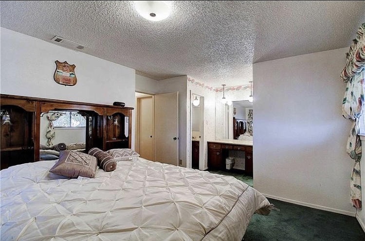 Austin Rock — Before, master bedroom with wood headboard set and en-suite bathroom