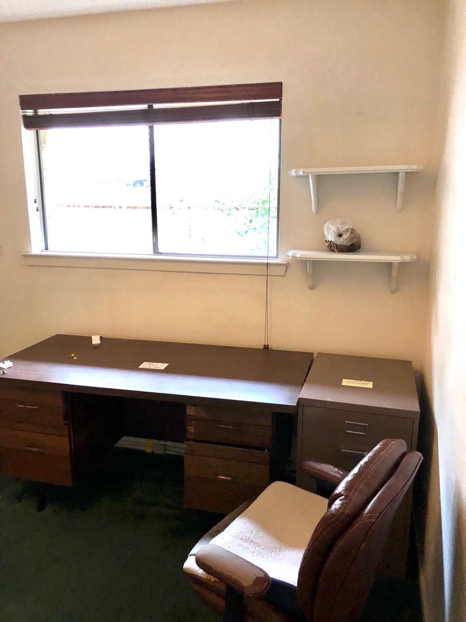Austin Rock — Before, bedroom with desk, shelving and green carpet