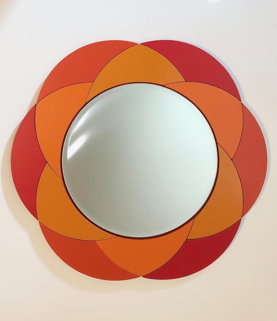Round convex mirror with red and orange petal flower frame
