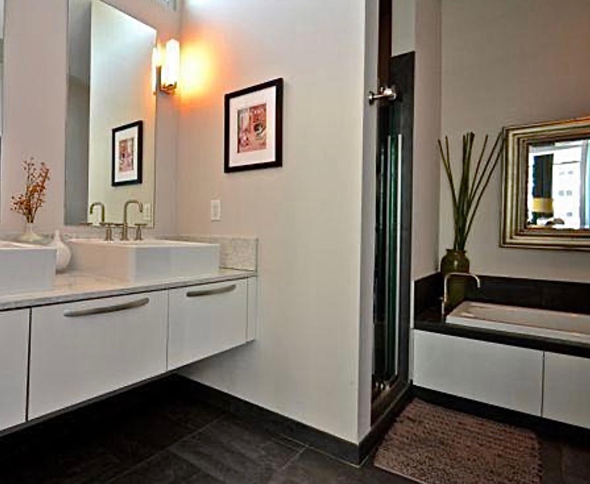 Nashville Gulch — Before, bathroom with floating vanity, soaking tub and framed artwork