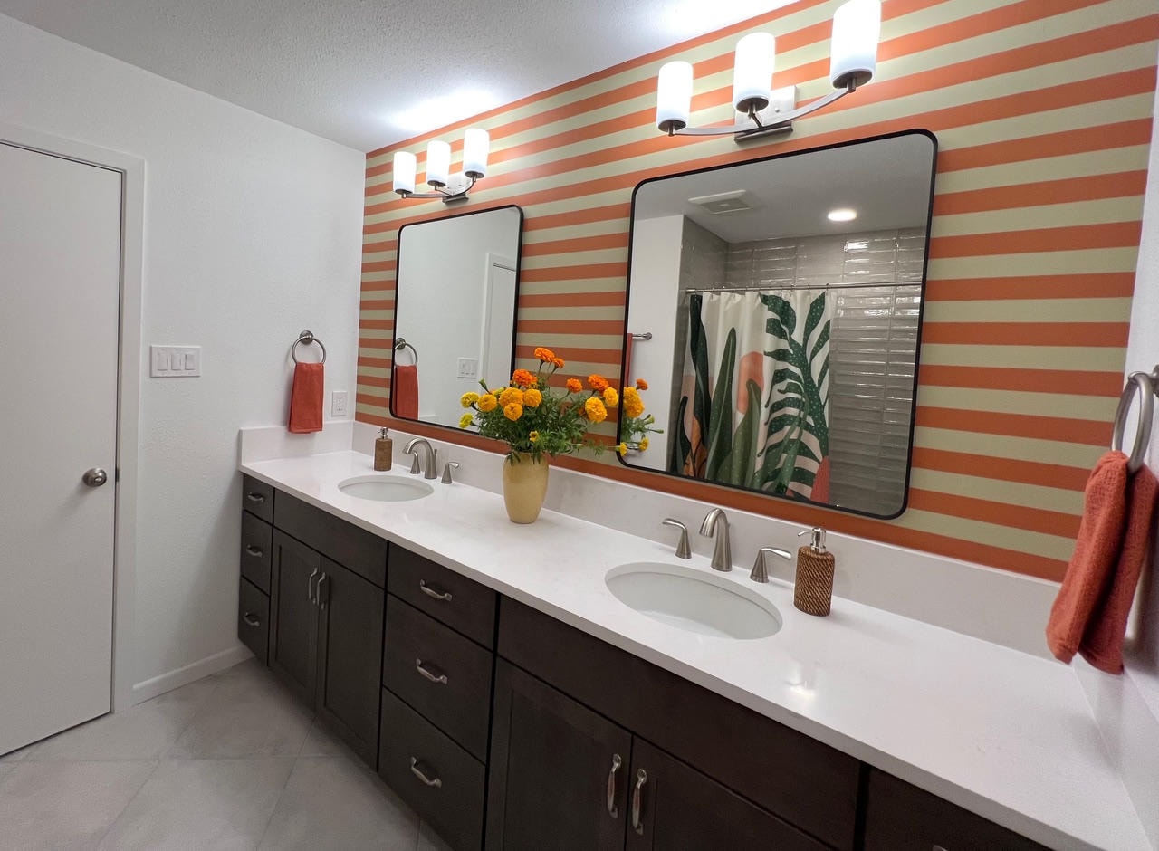 Austin Trail — After, bathroom with orange striped accent wall and dual vanity