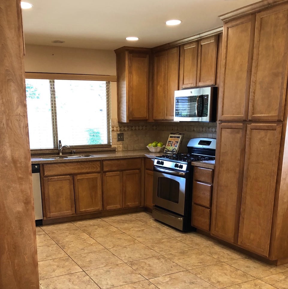 Austin Trail — Before, bathroom with white cabinets and yellow countertop