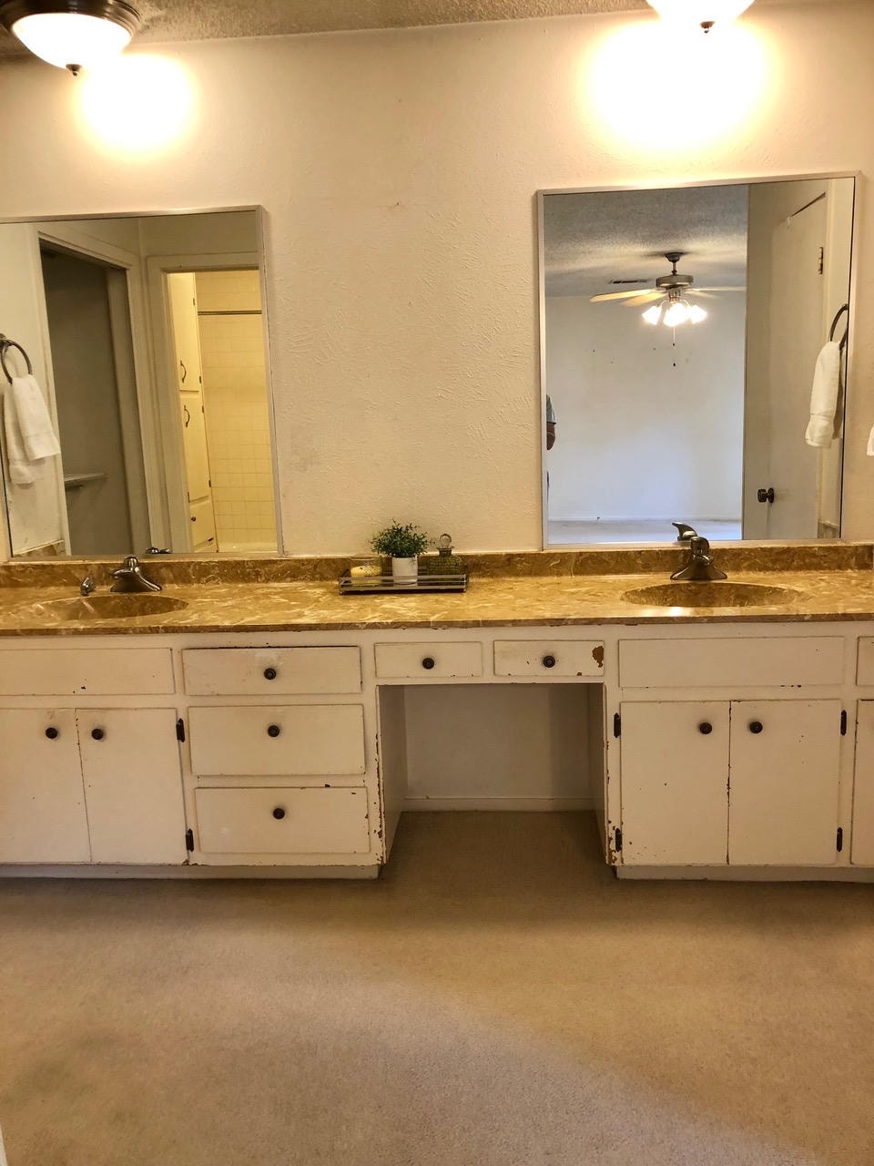 Austin Trail — Before, double vanity bathroom with dual mirrors and gold countertop