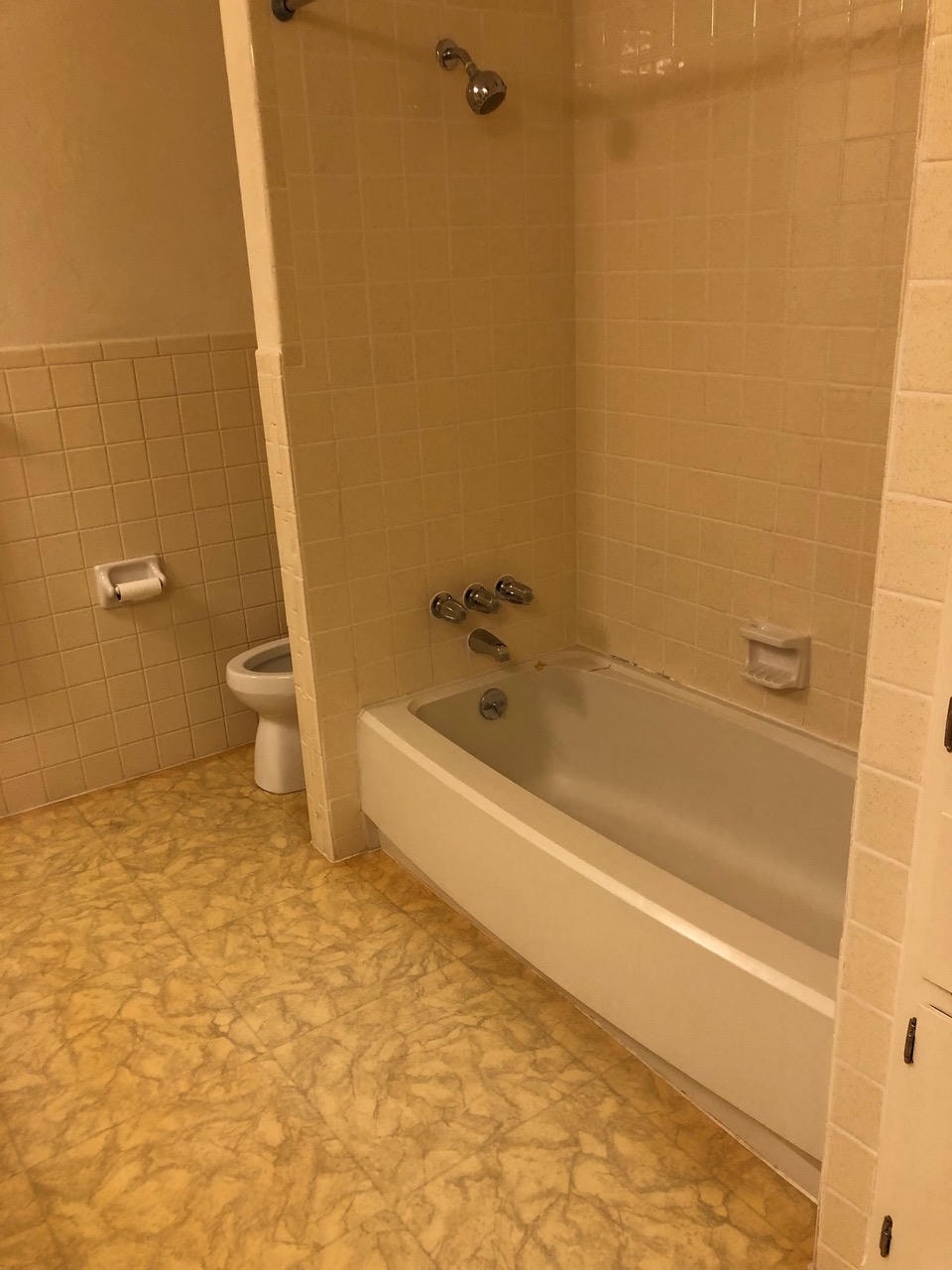 Austin Trail — Before, bathroom with white square tile, tub and marble vinyl floor