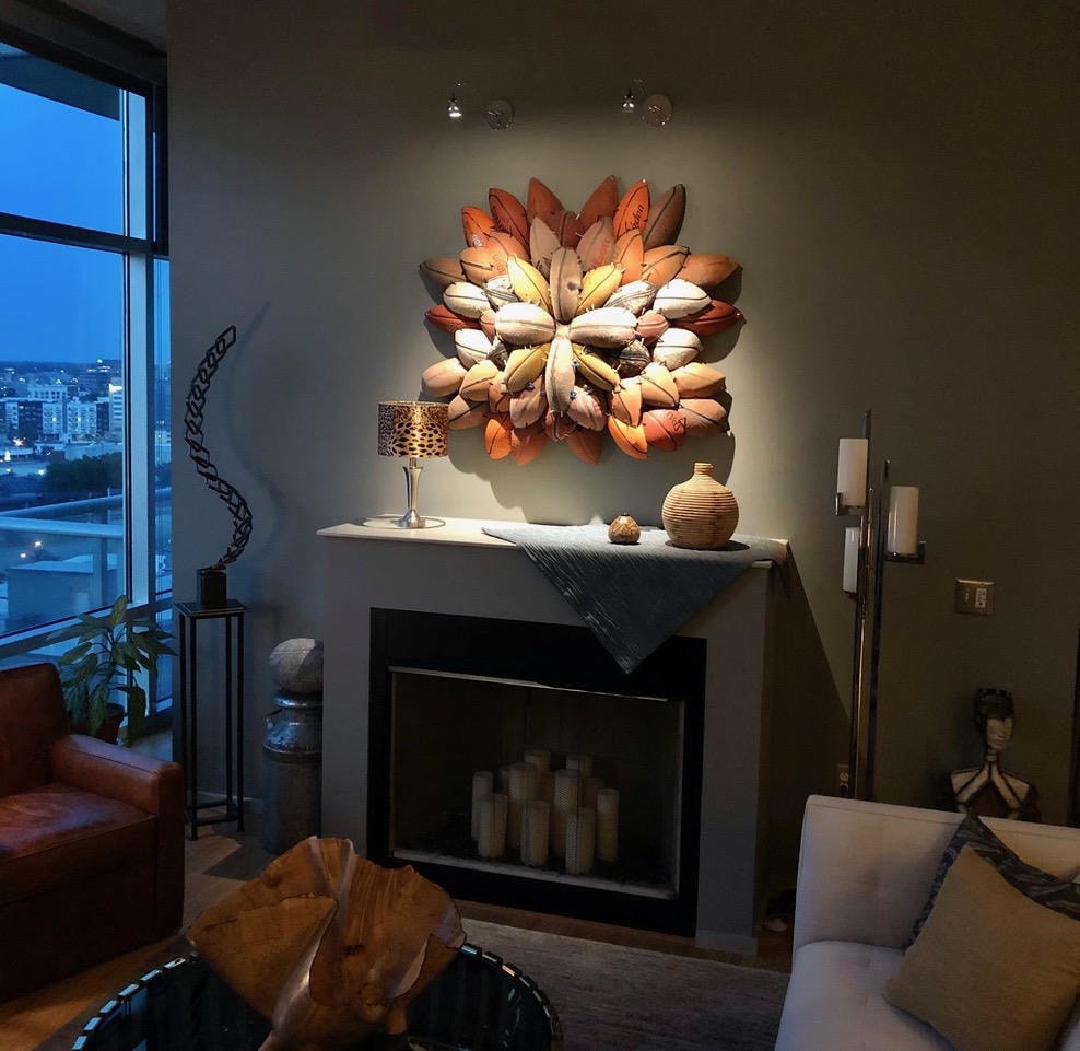 Nashville Gulch — After, fireplace with sculptural wall art and city views at night