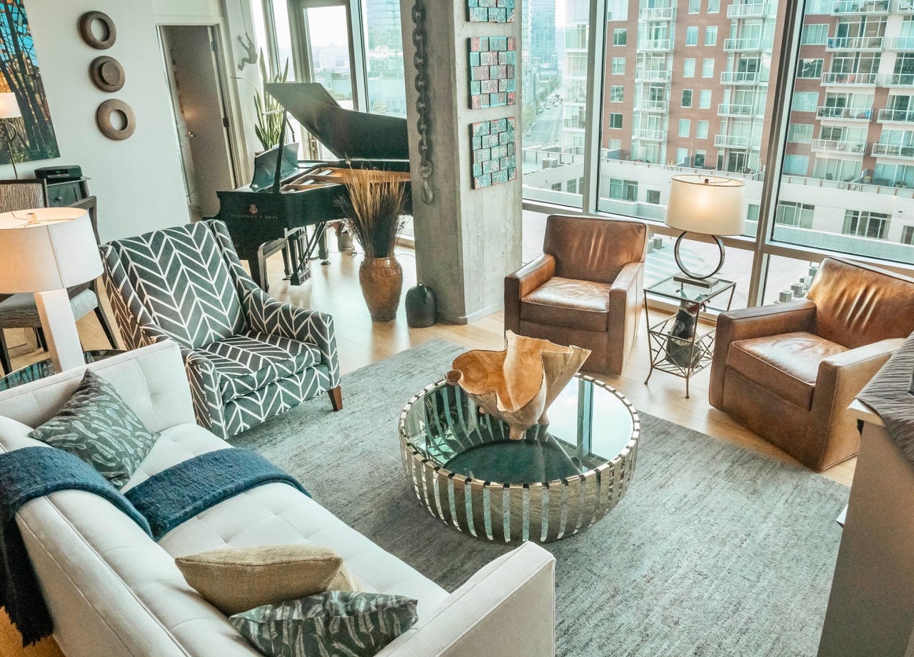 Nashville Gulch — After, living room with leather chairs, herringbone chair and Steinway piano