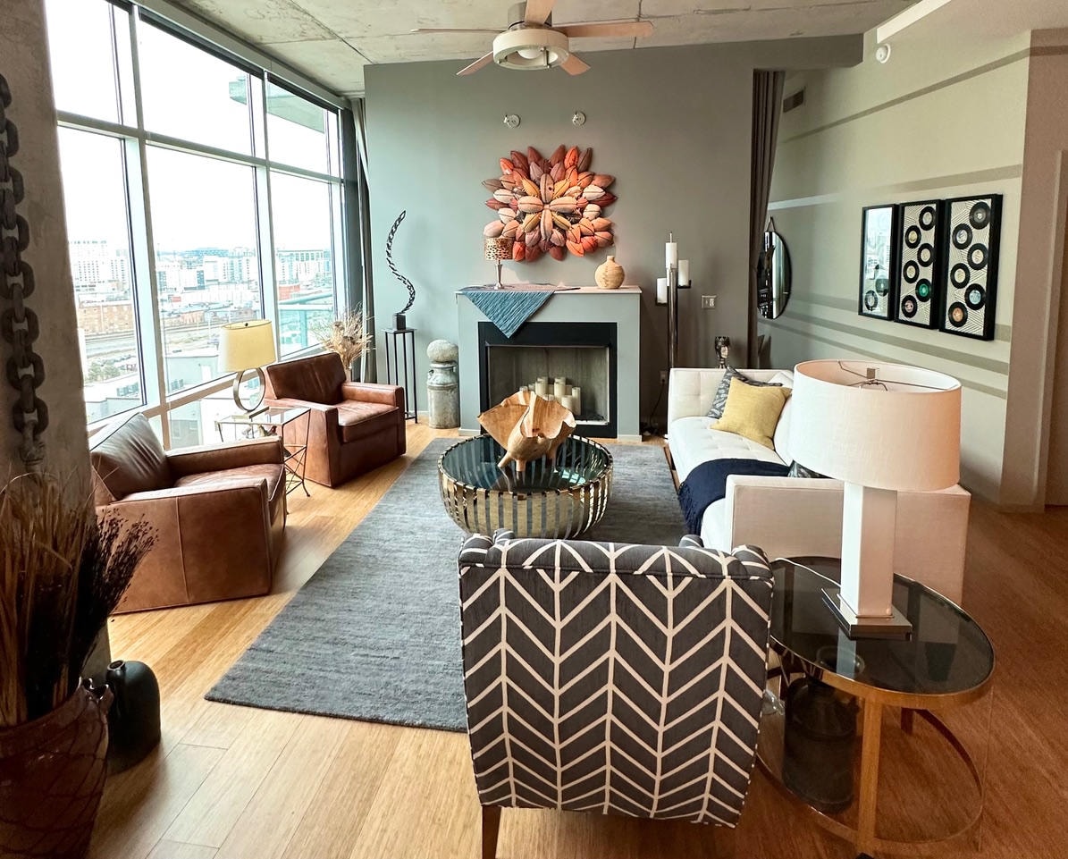 Nashville Gulch — After, wide living room view with fireplace, sculptural art and city views