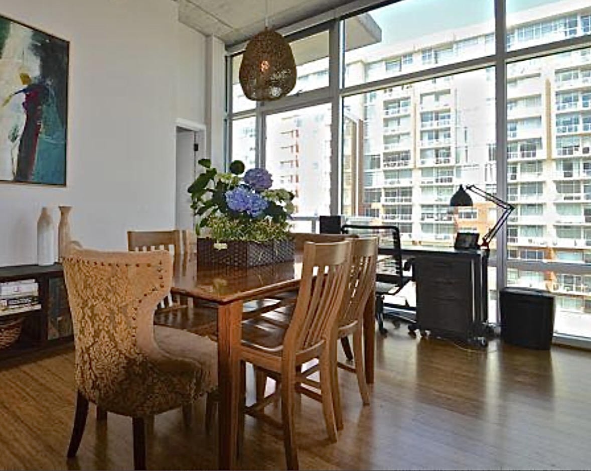 Nashville Gulch — Before, dining room with wood table, city views and woven pendant light
