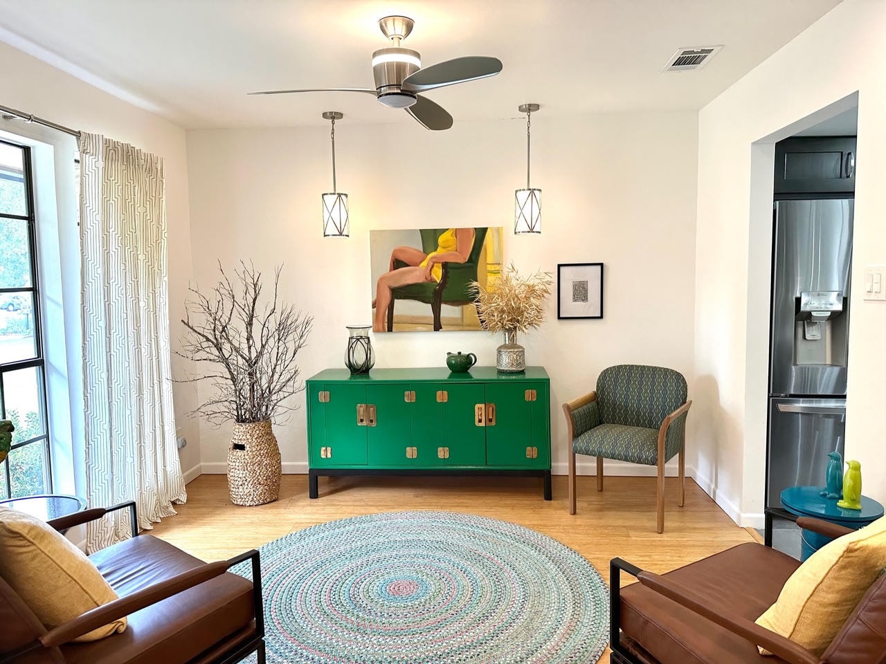 Austin Rock — After, sitting room with green credenza, artwork and round rug