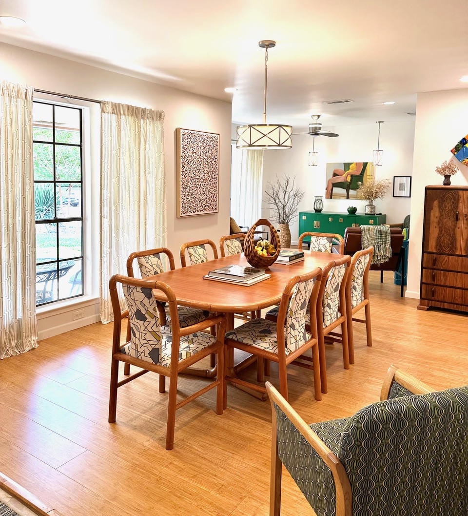 Austin Rock — After, dining room with rattan chairs and view into living room