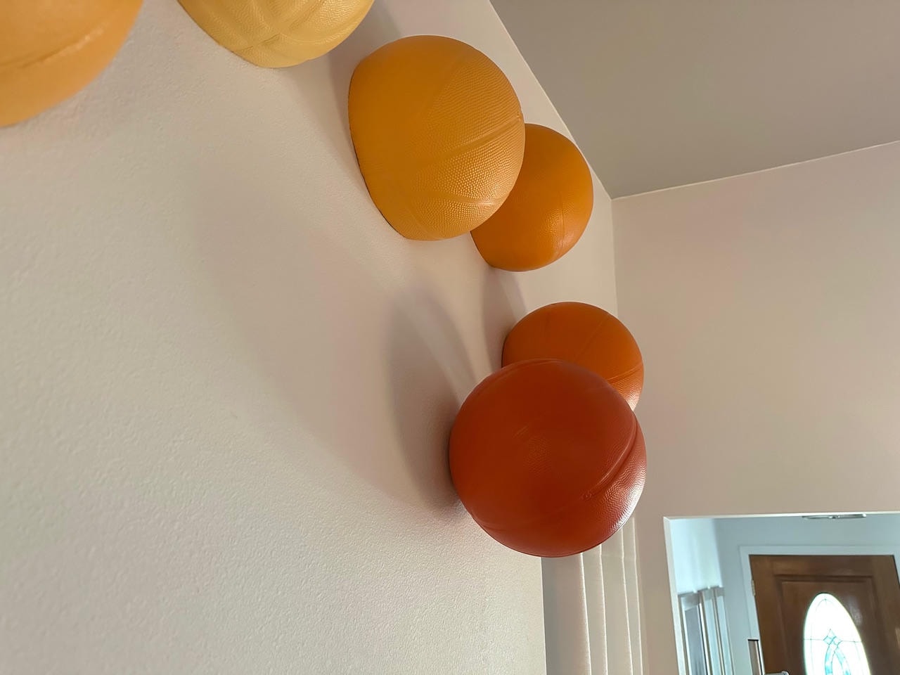 Austin Rock — After, decorative orange and rust spherical wall art installation