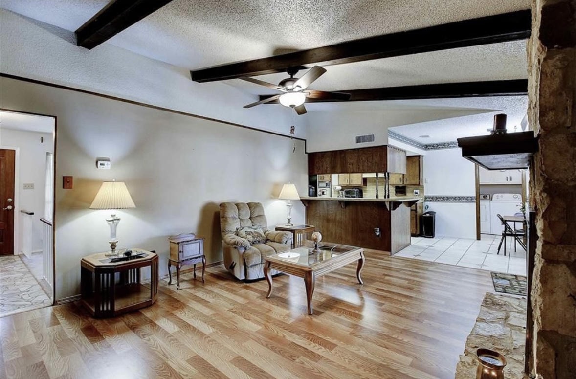 Austin Rock — Before, living room with wood beams and ceiling fan