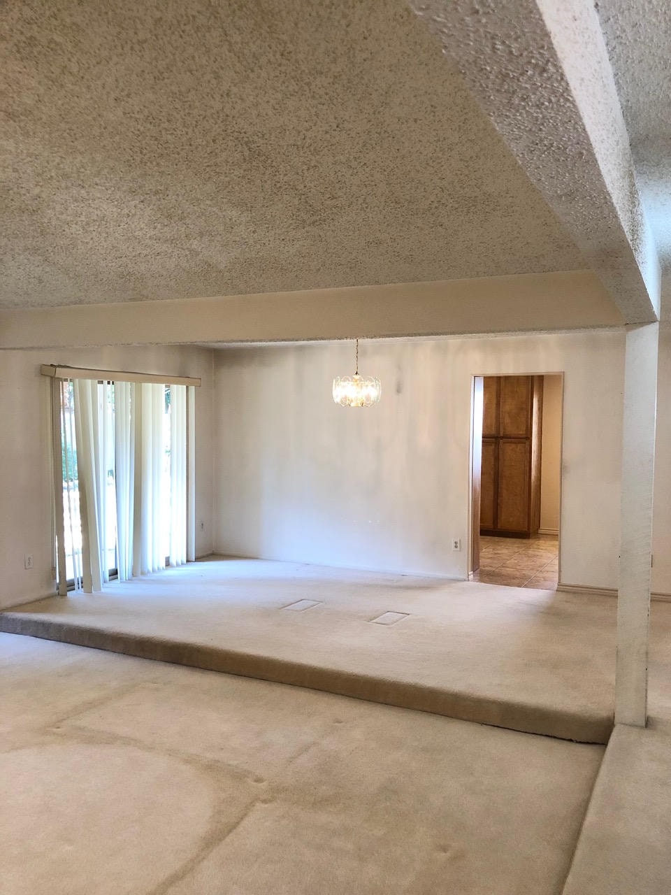 Austin Trail — Before, open living and dining space with sunken floor